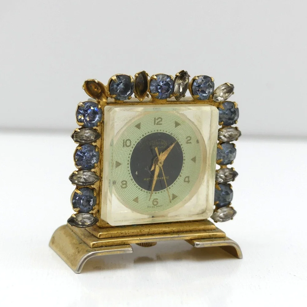 VTG Hilton Jeweled Antimagnetic Mini Skeleton Desk Clock Gold Tone Swiss Quartz
